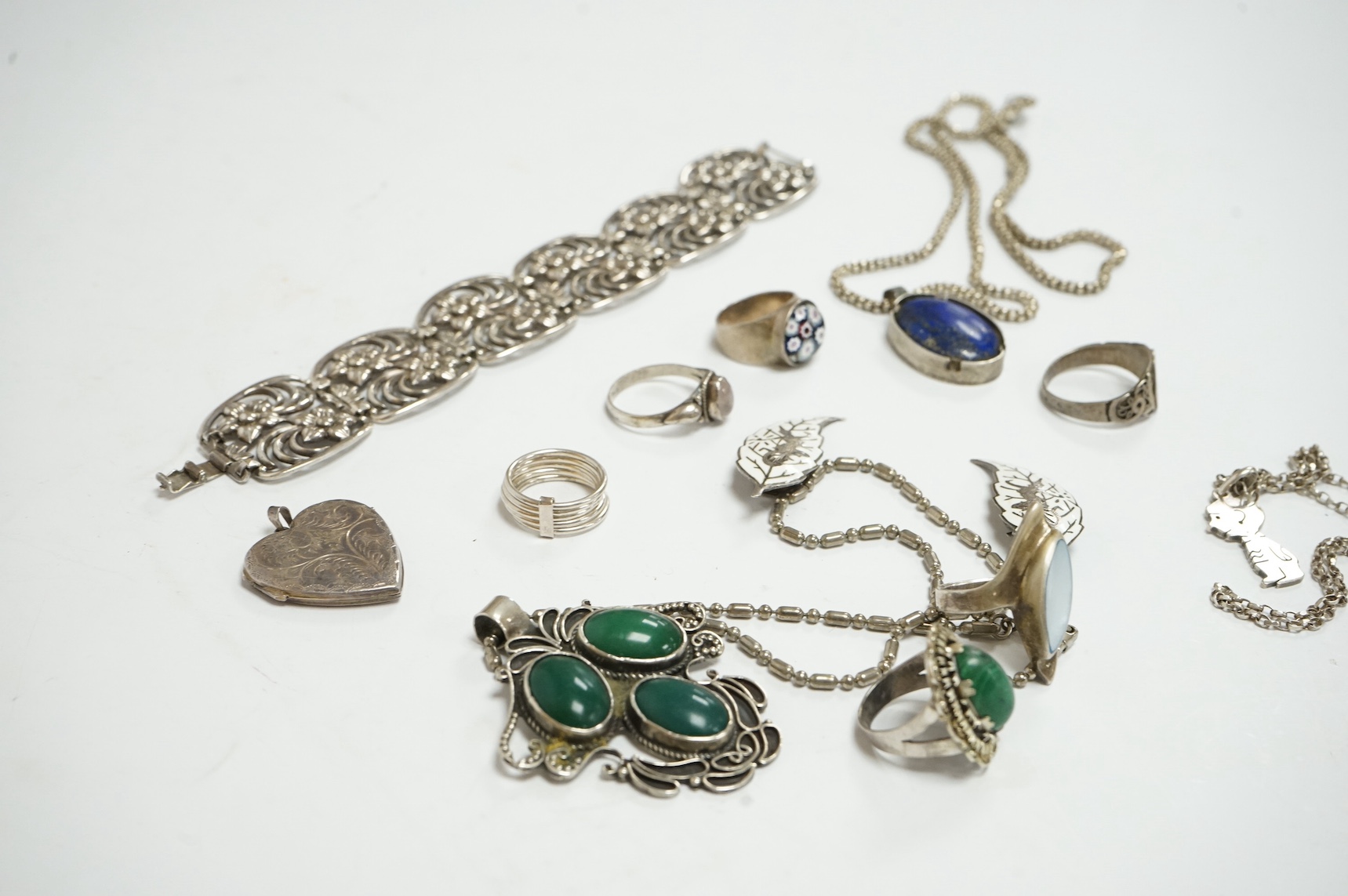 A small quantity of 925 and white metal jewellery including rings, bracelets and pendants. Condition - fair